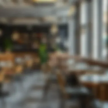 Elegant metal chairs paired with modern glass tables in a cozy indoor cafe